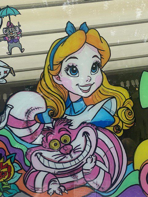 Alice in Wonderland window mural for a cafe in Bordon, Hampshire, to communicate themed afternoon teas. 