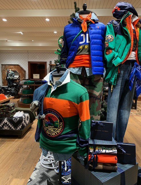 Ralph Lauren Menswear mannequins styled with coordinated outfits for Bicester Village launch visual merchandising.