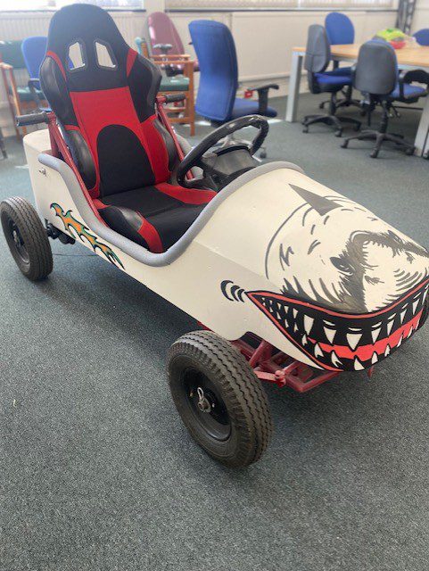 Hand‑painted shark illustration for the Soap Box Derby, created for WB Community Trust and Mercers Gym.