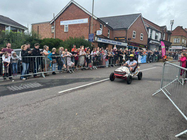 Bold shark‑themed artwork supporting a community charity event.