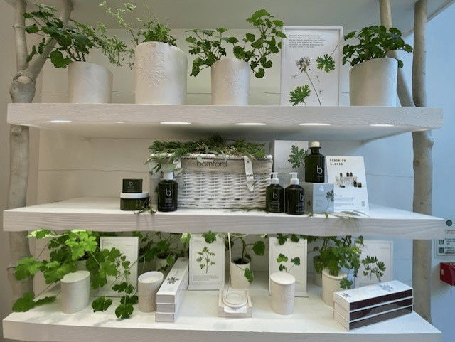 Visual merchandising display featuring luxury Daylesford London hampers styled for an in‑store event at Bamford, South Audley.